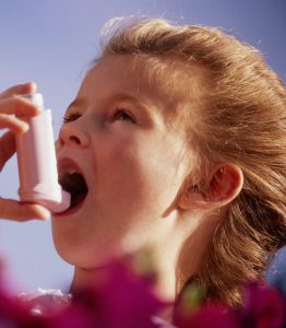 Child with inhaler -asthma